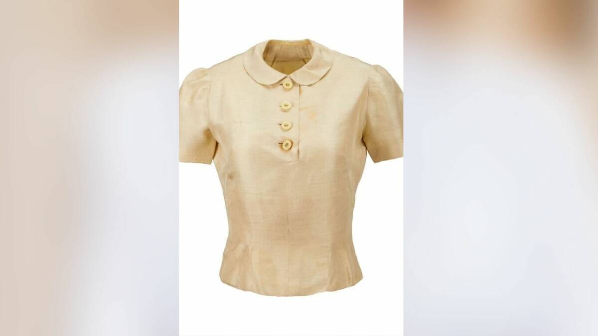 Cream silk blouse of Princess Diana sold for $2940. PIcture by Julien's Auctions
