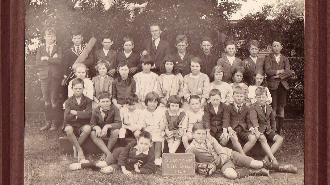 School 100 years ago. The Stonehenge class of 1924 are Back L-R: Cliff Smith, Alan Every, Jim Thompson, Arthur Goodwin, Percy Howarth (Teacher), Buster Smith, Mick Egan, Harry Sharman, Neville Madgwick, Rodney Fakes. Middle L-R: Jane Goodwin, Carmen McAlister, Phyllis McDonald, Topsy Egan, Cynthia Fakes, Verlie McAlister, Zelna Fakes, Cissy Croft, Sybil Madgwick. Front L-R: Bill Freeman, Gordon Smith, Lionel Ruming, Vene Smith, Joan Howarth, Geoffrey Howarth, Clive Egan, Ray Smith, Ron Smith, Lyall Howarth and Jock Smith.