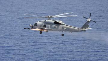 Flares were dropped about 300m in front of the Australian Seahawk chopper. (HANDOUT/ROYAL AUSTRALIAN NAVY)