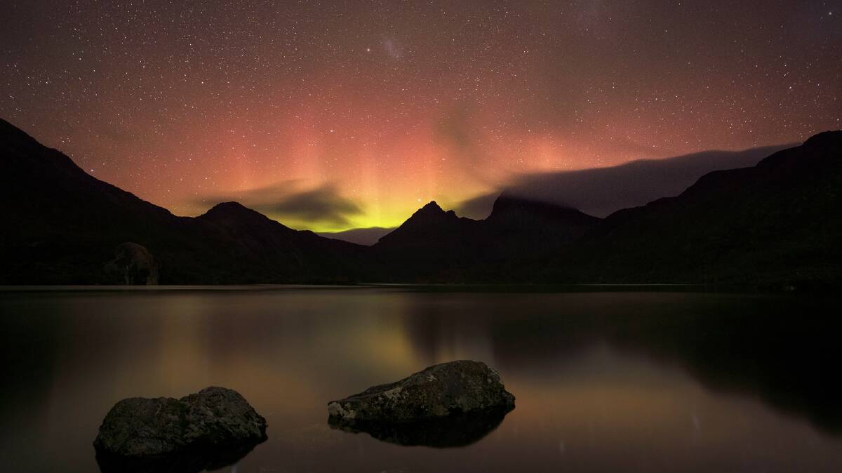 The Aurora Australis plays out over Cradle Mountain. Picture by Aaron Jones. 